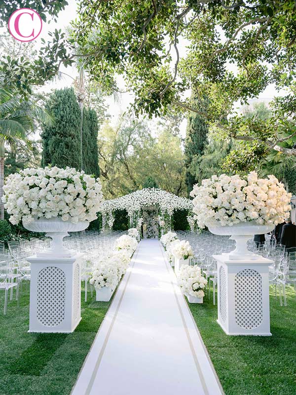 Most popular placement for wedding aisle runner is flush with the top row of chairs.