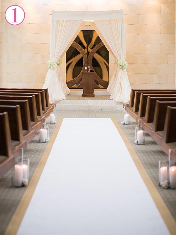 Most popular placement for wedding aisle runner is flush with the top row of chairs.