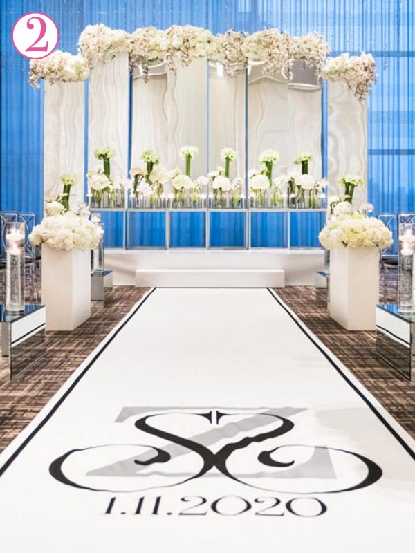 It looks great in photos to install the wedding aisle runner up a natural stopping point such as a platform or stairs.