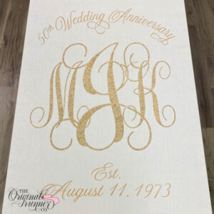 For the grand celebration of 50 years of marriage, renew your vows in an intimate ceremony surrounded by friends and family. Make a statement with your grand entrance by customizing the aisle runner. Your initials shine in a 3-letter gold glitter monogram, symbolizing the enduring love that has grown over half a century. Above, the words "50th Wedding Anniversary" add a touch of elegance and significance to the occasion. Include the date of the day you first got married, showcasing when the bond was initially established.